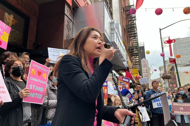 Susan Lee of the Alliance for Community Preservation and Betterment speaks at a rally opposing a plan to place a drop-in shelter with 94 stabilization beds at 231 Grand St.